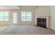 Spacious living room with a fireplace and lots of natural light at 513 Shadow Valley Ct, Lithonia, GA 30058