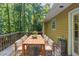 Inviting outdoor deck with wooden dining table and seating, perfect for entertaining or relaxation at 5341 Terrytown Ln, Lithonia, GA 30038