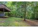 The home boasts a serene backyard with abundant trees and a deck, perfect for outdoor relaxation at 5341 Terrytown Ln, Lithonia, GA 30038