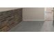 Unfinished basement with brick accent wall at 5341 Terrytown Ln, Lithonia, GA 30038