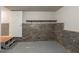Basement with brick accents and painted floor at 5341 Terrytown Ln, Lithonia, GA 30038
