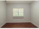 Clean bedroom with a window, and wood look floors at 5341 Terrytown Ln, Lithonia, GA 30038