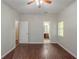 Bedroom includes ceiling fan, and views to an en-suite bathroom and hall at 5341 Terrytown Ln, Lithonia, GA 30038