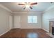 Spacious living room with hardwood floors and a stone fireplace at 5341 Terrytown Ln, Lithonia, GA 30038