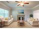 Bright living room with fireplace, ceiling fan, neutral paint, and a decorative rug and furniture at 5341 Terrytown Ln, Lithonia, GA 30038