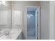 Clean bathroom with a single sink vanity and a glass-enclosed shower at 901 Chadwick Park Dr, Lawrenceville, GA 30045