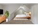 Serene bedroom with a sloped ceiling, neutral colors, and a minimalist design at 901 Chadwick Park Dr, Lawrenceville, GA 30045