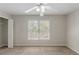Neutral bedroom with a window and closet, providing a simple yet functional space at 901 Chadwick Park Dr, Lawrenceville, GA 30045