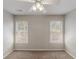 Clean bedroom with two windows offers ample natural light at 901 Chadwick Park Dr, Lawrenceville, GA 30045