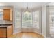 Bright breakfast nook with hardwood floors, large windows, and a view of the outdoors at 901 Chadwick Park Dr, Lawrenceville, GA 30045