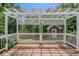 Wooden deck with white lattice and railing overlooking the landscaped yard at 901 Chadwick Park Dr, Lawrenceville, GA 30045