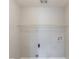 Unfinished laundry room with a wire shelf and utility connections at 901 Chadwick Park Dr, Lawrenceville, GA 30045