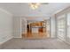 Open-concept living room flows into the kitchen, showcasing hardwood floors and natural light at 901 Chadwick Park Dr, Lawrenceville, GA 30045