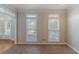 Comfortable living area with large windows and neutral walls at 901 Chadwick Park Dr, Lawrenceville, GA 30045