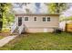 Back exterior of a home with siding, a covered carport, and minimal landscaping at 2245 Dauphine St, Atlanta, GA 30344