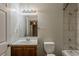 A full bathroom features a vanity with sink, toilet, shower and tub at 2245 Dauphine St, Atlanta, GA 30344
