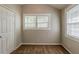 Bedroom showing a window with natural light, closet, and neutral walls at 2245 Dauphine St, Atlanta, GA 30344