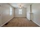 An inviting bedroom features neutral walls, carpet, ceiling fan and natural light from the windows at 2245 Dauphine St, Atlanta, GA 30344