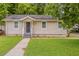 Charming single-story home with a well-maintained front lawn and inviting entrance at 2245 Dauphine St, Atlanta, GA 30344