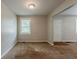 A comfortable living room features neutral walls, carpet and natural light from the windows at 2245 Dauphine St, Atlanta, GA 30344