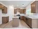 Well-lit kitchen featuring granite countertops, stainless steel appliances, an island and wood look floors at 334 Bloomfield Cir, Canton, GA 30114
