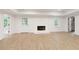 Bright basement showcasing a fireplace, white brick surround, and natural light at 3795 Newport Bay Dr, Alpharetta, GA 30005