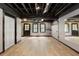 Spacious basement with exposed ceiling, light floors, and lots of natural light through multiple windows at 3795 Newport Bay Dr, Alpharetta, GA 30005