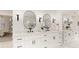 Elegant bathroom with double vanities, quartz counters, black fixtures, and decorative mirrors at 3795 Newport Bay Dr, Alpharetta, GA 30005