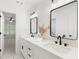 Elegant bathroom features double sink vanity, modern fixtures, and an open doorway to bedroom at 3795 Newport Bay Dr, Alpharetta, GA 30005