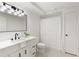 Charming bathroom with white vanity, brushed black fixtures, and shower with a white curtain at 3795 Newport Bay Dr, Alpharetta, GA 30005