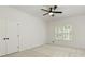 Cozy bedroom with neutral carpet, shuttered windows, and ample closet space at 3795 Newport Bay Dr, Alpharetta, GA 30005