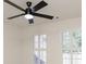 This bright bedroom has a ceiling fan, carpet, shutters on the windows, and is airy at 3795 Newport Bay Dr, Alpharetta, GA 30005