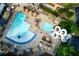 Stunning aerial view of a community pool area featuring a lazy river and water slide at 3795 Newport Bay Dr, Alpharetta, GA 30005