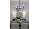 Close-up of the dining room featuring stylish chandelier and modern art at 3795 Newport Bay Dr, Alpharetta, GA 30005