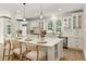 Spacious kitchen with a large center island, quartz countertops, stainless steel appliances, and ample cabinet space at 3795 Newport Bay Dr, Alpharetta, GA 30005