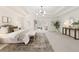 Spacious main bedroom with trey ceilings, neutral colors, ensuite living room and ample natural light at 3795 Newport Bay Dr, Alpharetta, GA 30005