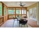 Inviting screened-in porch with seating, ceiling fan, and natural light at 3795 Newport Bay Dr, Alpharetta, GA 30005