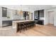 Modern kitchen featuring an island with seating and stainless steel appliances at 5120 Token Chase, Cumming, GA 30040