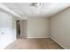 Neutral basement with carpet flooring, white door, and view to the stairs at 5207 Shawn Ln, Stone Mountain, GA 30088
