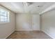 The basement area features carpeted floors, bright walls, and a single window at 5207 Shawn Ln, Stone Mountain, GA 30088