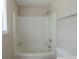 This bathroom has a shower and tub with a bright white finish and a standard toilet at 5207 Shawn Ln, Stone Mountain, GA 30088