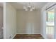 The dining room offers a modern chandelier and access to the outdoor deck at 5207 Shawn Ln, Stone Mountain, GA 30088