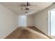 Empty garage with white walls, concrete flooring, and an automatic garage door at 5207 Shawn Ln, Stone Mountain, GA 30088