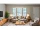 Bright living room with neutral tones, large windows, and stylish furniture at 5207 Shawn Ln, Stone Mountain, GA 30088