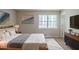 Inviting main bedroom with a comfortable bed, soft lighting, and modern decor at 5207 Shawn Ln, Stone Mountain, GA 30088