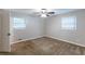 Neutral bedroom with plush carpeting and two large windows that provide plenty of light at 1105 Buckhurst Dr, Atlanta, GA 30349