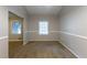 Dining room with chair rail, neutral paint, and two windows for ample natural light at 1105 Buckhurst Dr, Atlanta, GA 30349