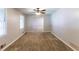 Bright living room featuring neutral paint, plush carpeting, and a large window at 1105 Buckhurst Dr, Atlanta, GA 30349
