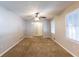Inviting living room with neutral paint, plush carpeting, and a ceiling fan at 1105 Buckhurst Dr, Atlanta, GA 30349