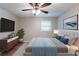 Cozy bedroom features a comfortable bed, a dresser, and a window offering plenty of natural light at 1105 Buckhurst Dr, Atlanta, GA 30349